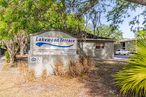 A sign for Lakewood Terrace with a wheelchair symbol indicating accessibility.