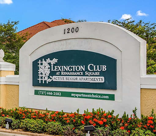 A sign for Lexington Club at Renaissance Square shows a phone number and website.