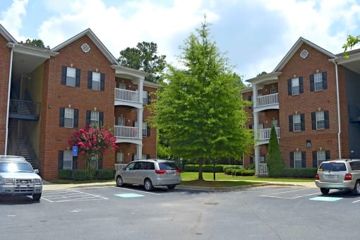 a parking lot in front of an apartment building