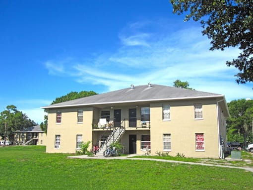A two-story building with a balcony on the second floor.
