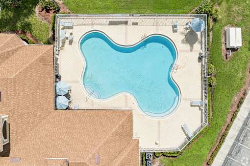 A large swimming pool in a backyard.