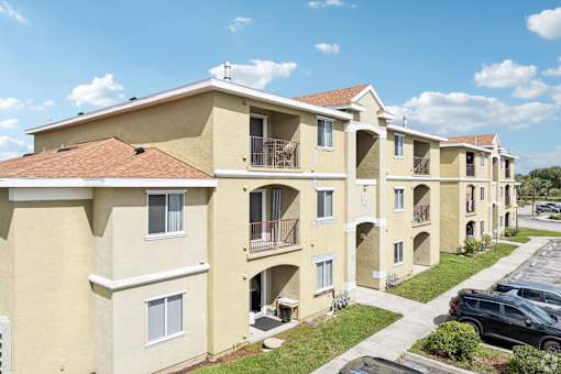 A row of apartment buildings with balconies and windows.
