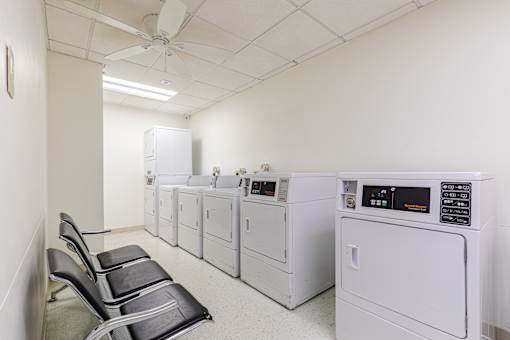 A row of washing machines in a laundromat.