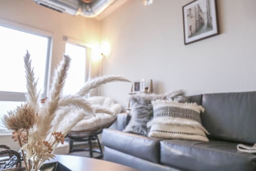 a living room with a couch and a table at Bluestone Lofts, Duluth, Minnesota