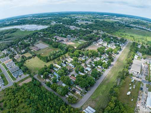 an aerial view of a neighborhood with houses and trees