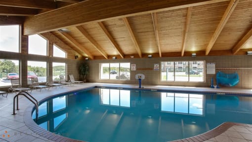 a swimming pool under a wooden ceiling in a hotel at Boulder Ridge, Duluth, 55811
