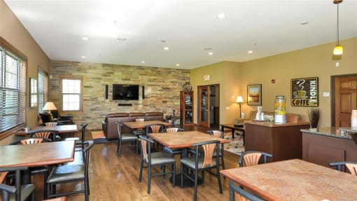 a restaurant with tables and chairs and a fireplace at Boulder Ridge, Duluth, MN 55811