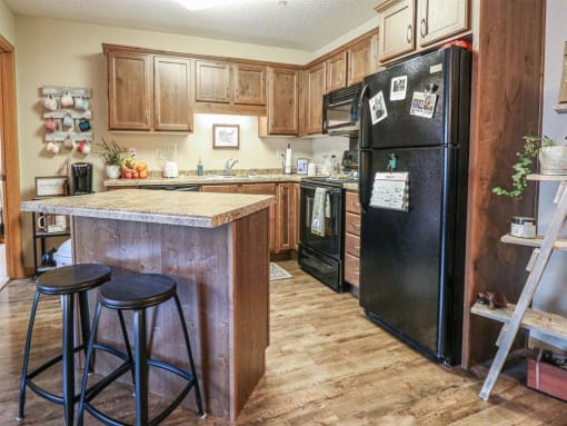 a kitchen with a counter top and a refrigerator at Boulder Ridge, Duluth, 55811