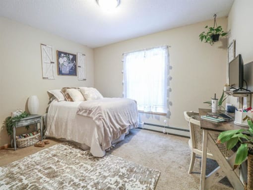 a bedroom with a bed and a tv at Boulder Ridge, Duluth, 55811