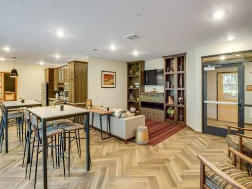 a kitchen and dining room with a table and chairs at Arbor Ridge, Minnesota