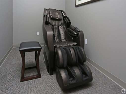 a massage chair and a stool in a room at Arbor Ridge, Forest Lake, 55025