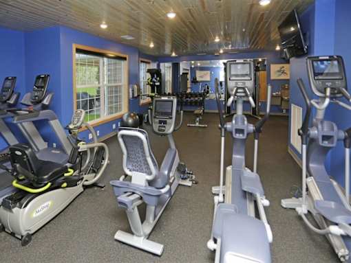 the gym is equipped with a variety of exercise equipment at Arbor Ridge, Forest Lake, Minnesota