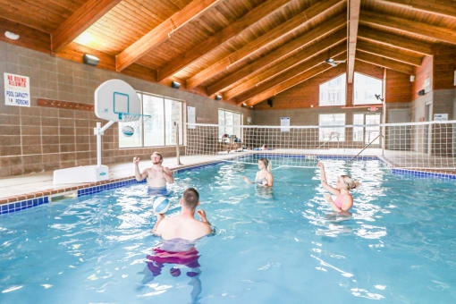 a group of people playing in a swimming pool at Summit Ridge, Duluth