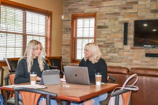 two women sitting at a table in a restaurant at Summit Ridge, Duluth