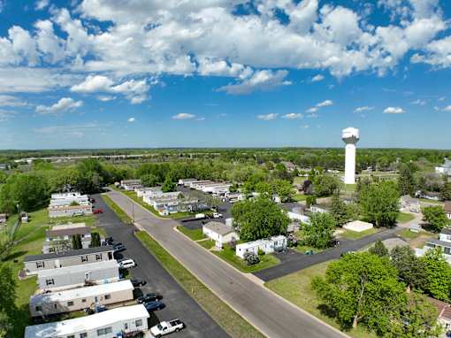 an aerial view of a neighborhood with a water tower