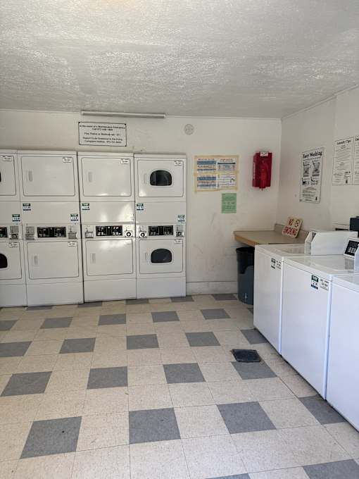 A laundromat with washers and dryers.