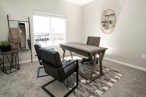 A room with a table and chairs in it.