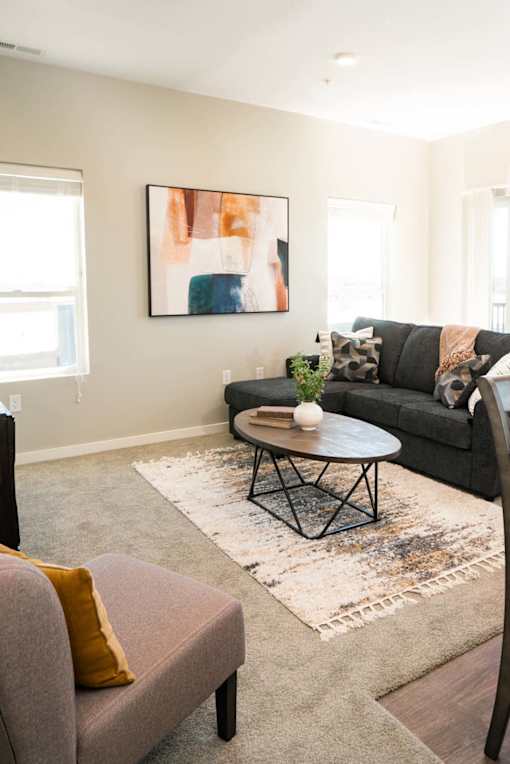 A room with a rug and furniture