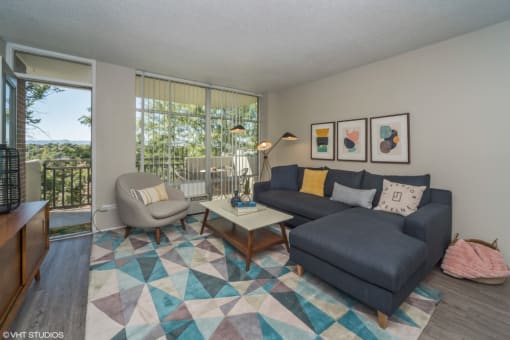 Spacious living room with natural lighting and balcony access