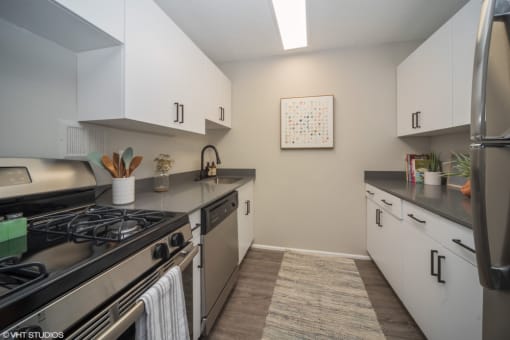 Sleek kitchen with a gas top stove