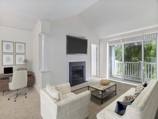Bright living room with neutral-toned furniture, a fireplace with wall-mounted TV, home office setup, and large glass doors opening to a private balcony.