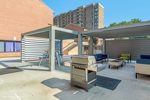 Enjoy the fire pit while you BBQ on our deluxe gas grills at Trillium Apartments, Fairfax, VA