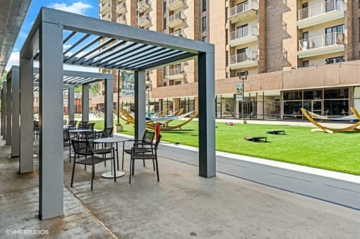 Bistro seating to enjoy the Virginia breezes in The Plaza at Trillium Apartments, Fairfax, Virginia