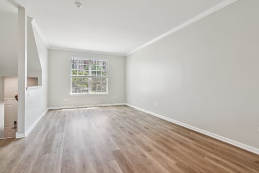 Davey Two Bedroom Townhome - large living room with rich wood flooring