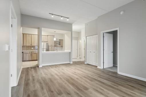 A spacious kitchen with a sink and a countertop.