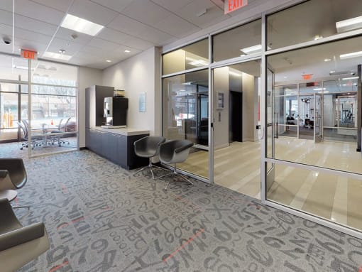 Bright glass business center with complimentary Starbucks at Trillium Apartments, Fairfax, VA