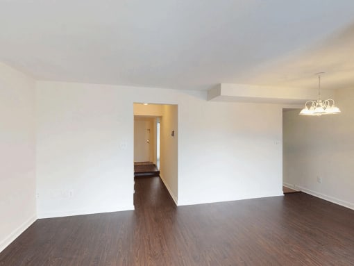 Spacious living space with vinyl flooring at Trillium Apartments, Virginia