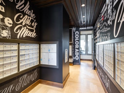 a retail store with black walls and glass cases of shoes