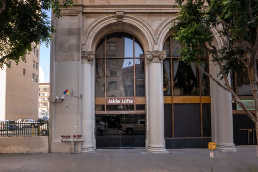 the facade of a building with a glass door and an arched doorway