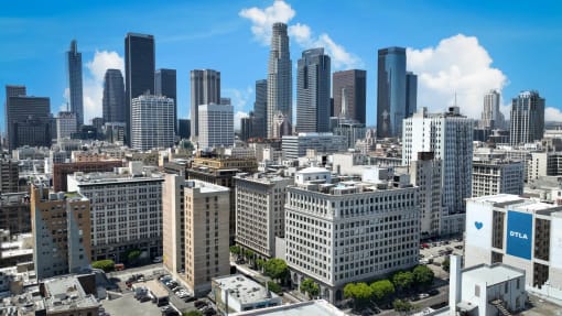 an aerial view of a city with tall buildings and skyscrapers