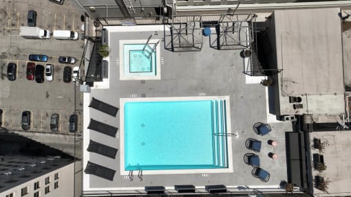 an aerial view of a swimming pool on the roof of a building