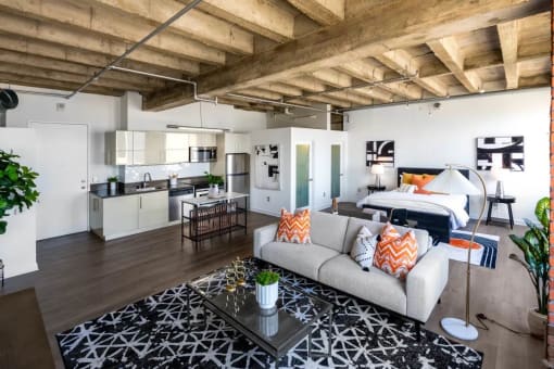 a living room and kitchen in a loft