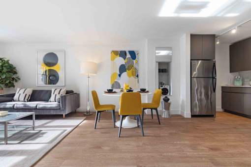 Open concept living area with wood-look plank flooring