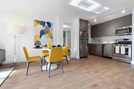 Lacquered matte cabinetry and  stainless steel appliances