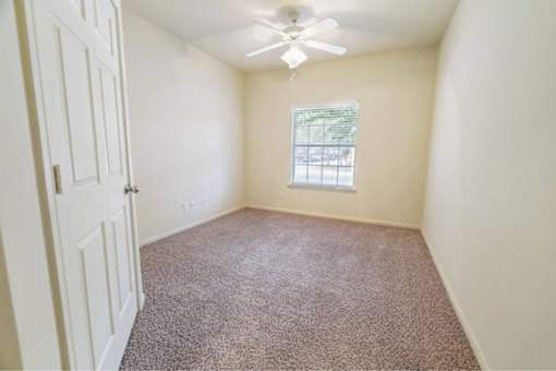 Bedroom with a ceiling fan Stonehaven Apartments in Houston, TX