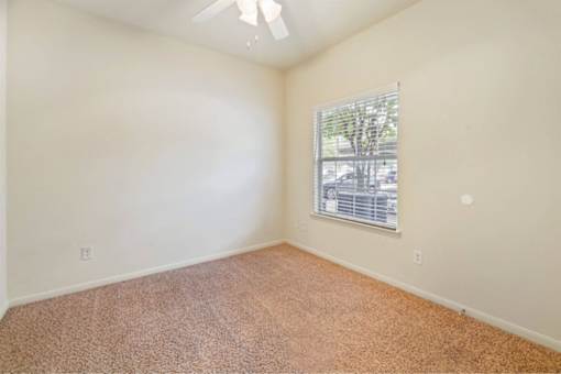 Bedroom with a ceiling fan Stonehaven Apartments in Houston, TX
