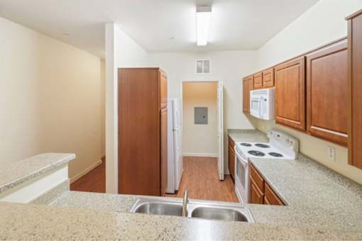 Open concept kitchen with plenty of counter space at Stonehaven Apartments in Houston, TX