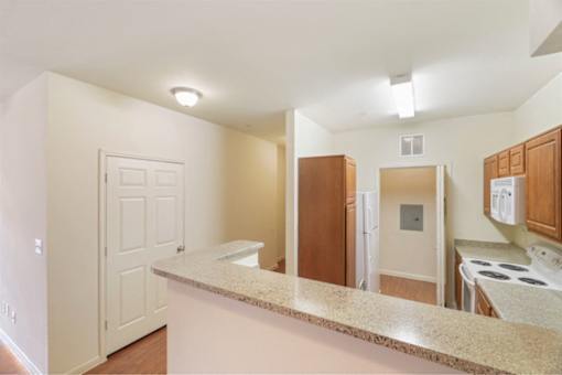 Kitchen with a breakfast bar at Stonehaven Apartments in Houston, TX