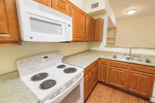 Kitchen with microwave at Stonehaven Apartments in Houston, TX