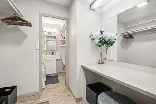 Large vanity area outside of the chic bathroom at Archer Tower in Denver, CO