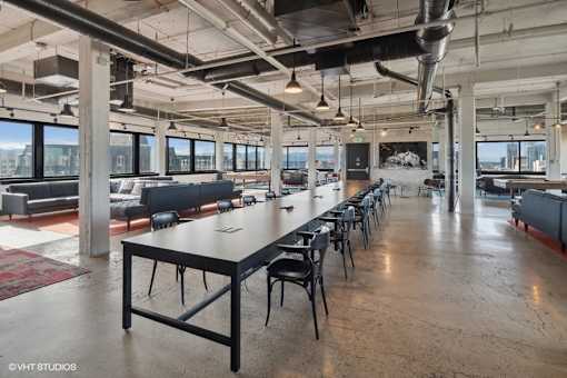 Penthouse entertainment lounge with fireplace at Archer Tower in Denver, CO