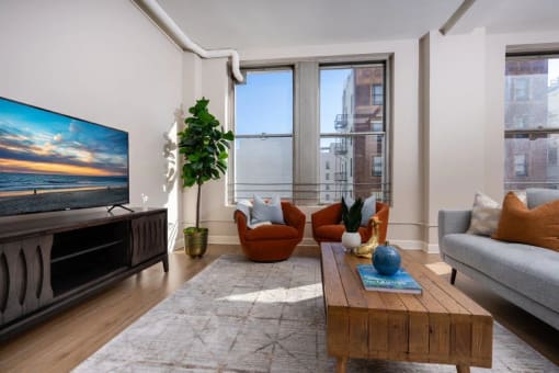 a living room with a couch and a table and a tv