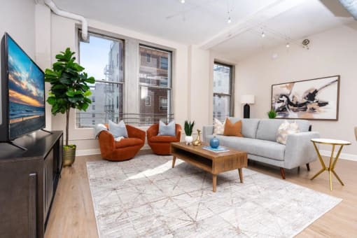 a living room with a couch and a tv