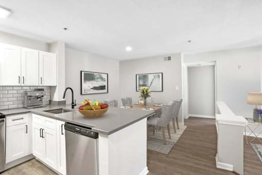 Open concept kitchen with stainless steel appliances at The Crossings at Russett in Laurel, MD