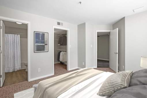 Primary bedroom with convenient private bathroom access and a large closet  at The Crossings at Russett in Laurel, MD
