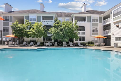 Resort-style pool with sun deck at The Crossings at Russett in Laurel, MD